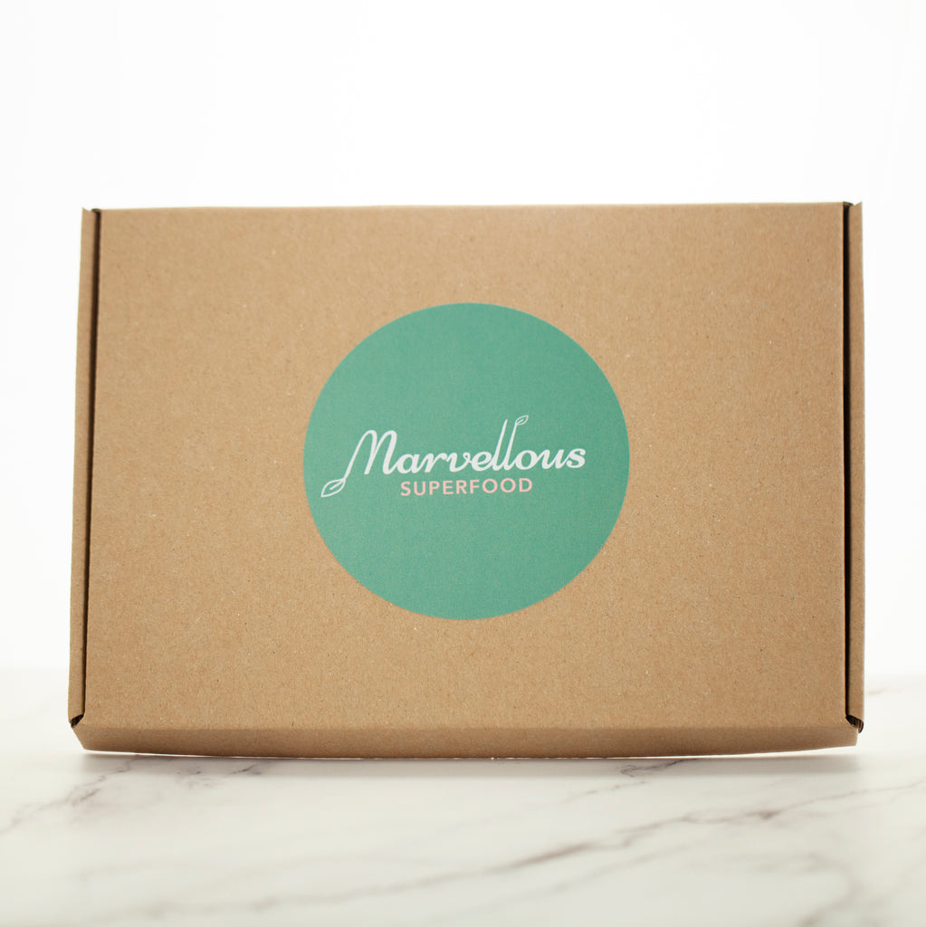 A compostable gift box with Marvellous Superfood logo on the front.